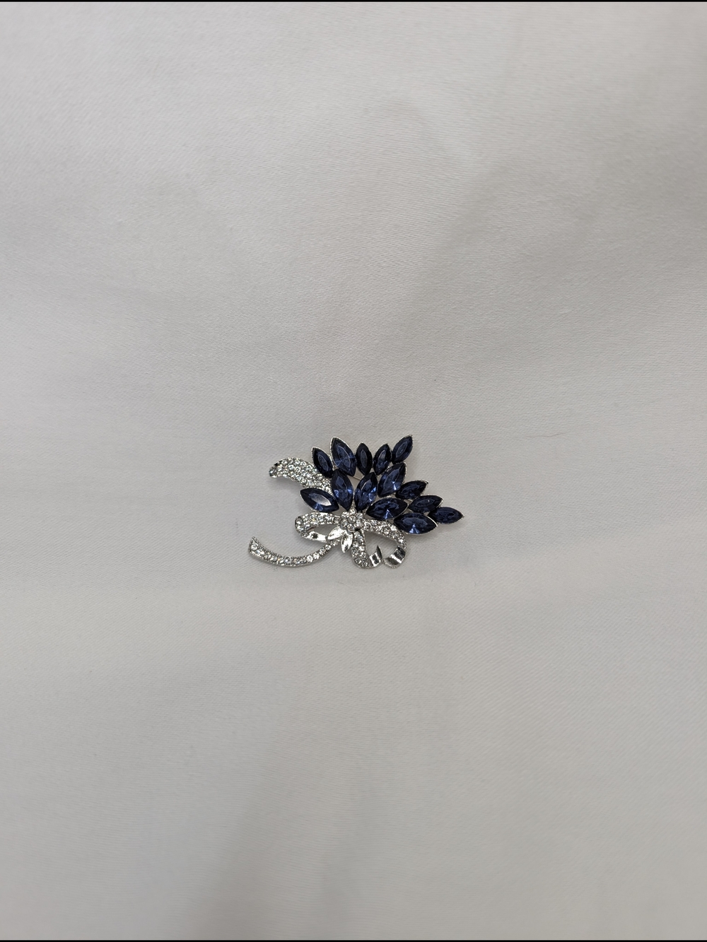 Silver Floral Brooch with Deep Blue Stones